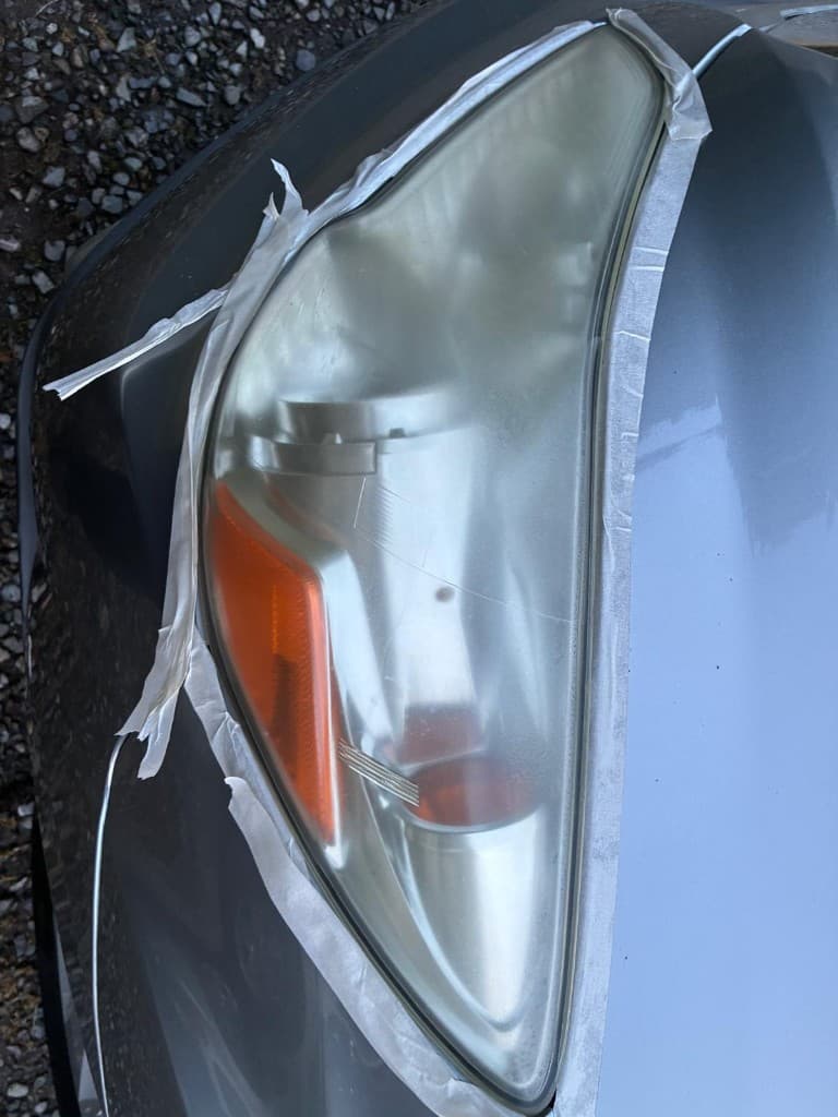 Oxidized cloudy headlight lens before restoration